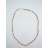 A 9ct gold necklace, composed of two twisted box-link strands, 9.7g