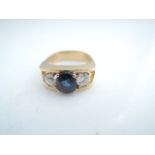 A sapphire and diamond ring, centred with an oval mixed-cut sapphire weighing approximately 1.52cts,