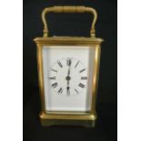 A brass carriage clock by Henri Jacol with enamel dial case. Key and movement all numbered 16598 and