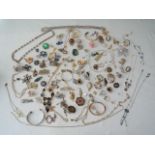 A miscellaneous collection of costume jewellery, including fifty various brooches, necklaces, etc,