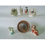 A collection of 19th century ceramics including a pair of Staffordshire figure groups of a boy and a