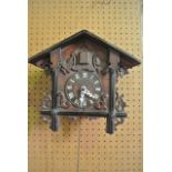 A late 19th century cuckoo clock, the case of chalet form with applied and carved mouldings