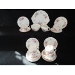 A six place Royal Crown Derby Derby Posies pattern tea service comprising milk jug, sugar bowl, cake