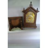 A small 19th century oak bracket clock and bracket, the architectural case with carved detail