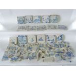 A quantity of 18th and 19th century tin glazed tiles with blue and white painted decoration,