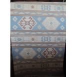 A flat weave Kelim runner in pale blue and cream shades with geometric detail, 260 x 75 cm