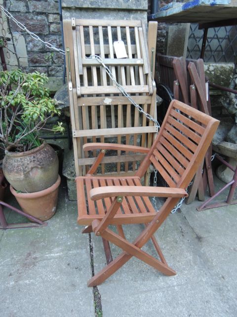 A contemporary hardwood steamer type chair with slatted seat and back together with four further