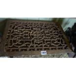 A Victorian cast iron vent of rectangular form with decorative pierced scrolling acanthus top and