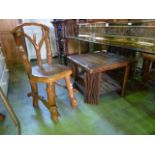 A rustic hardwood two tier occasional table with square top and canted supports together with a