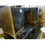 A vintage Stag kneehole dressing table of curved form fitted with an arrangement of seven frieze