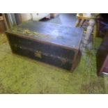 A vintage fibre and steel reinforced cabin trunk with leather carrying handles and partially