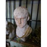 A faux weathered terracotta head and shoulder bust of a man
