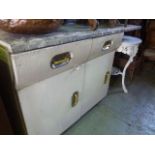 A vintage English Rose kitchen cabinet with partially painted finish enclosed by two doors and two