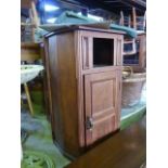 A pair of bedside cupboards of breakfront pedestal form each enclosed by a panelled door beneath