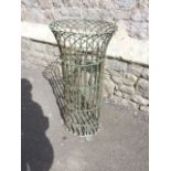 A Victorian wirework planter of cylindrical form with three flattened shaped feet