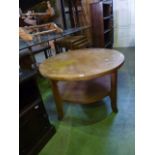 An Edwardian mahogany oval drop leaf Sutherland type tea table together with a nest of three