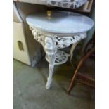 A W G Grace cast iron pub table with face mask, pierced floral and other detail beneath an