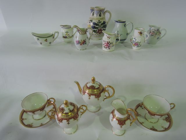 A collection of 19th century French cabinet wares in the Limoges manner comprising teapot, covered