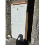 Four reclaimed doors of varying design, all with painted finish