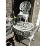 A Victorian style cast aluminium four piece terrace set comprising table with decorative circular