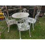 A Victorian style cast aluminium garden terrace table of circular form with decorative pierced