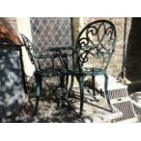 A contemporary cast aluminium three piece terrace set comprising table with decorative pierced