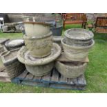 One lot of weathered cast composition stone garden planters of varying size and design
