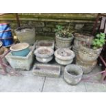 One lot of mainly weathered cast composition stone garden planters of varying size and design, a