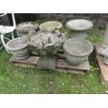 One lot of cast composition stone garden urns/planters of varying size and design, some with