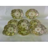 A collection of 19th century dessert wares in the Coalport manner with painted floral sprigs and