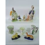 A collection of mainly 19th century ceramics including Staffordshire figures comprising The Lion