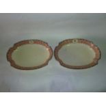 A pair of early 19th century Wedgwood serving dishes of oval form with painted leopard crest and