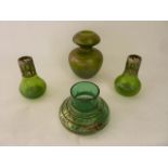 An unusual early 20th century green studio glass vessel with bladed neck and bulbous bowl, with