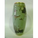 A 19th century oriental vase of curved cylindrical form with painted and gilded decoration on a