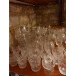 An extensive collection of clear cut drinking glasses to include numerous tumblers, brandy balloons,
