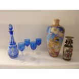 A cameo cut clear and cobalt blue glass decanter with four associated glasses together with an