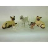 Two Beswick models of recumbent Siamese Cats with impressed numbers to base numbers 1558 and 1559, a