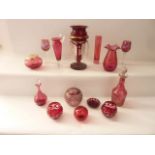 A selection of cranberry glassware to include a single Victorian table lustre with hand painted