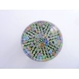 A Perthshire Millefiori paperweight dated 1982 decorated with a central cluster of multi-coloured