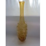 A tall contemporary amber coloured studio glass vase of cylindrical form with drawn neck and applied