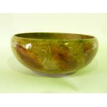 A Royal Doulton bowl with impressed autumn leaf decoration on a mottled brown ground, with impressed