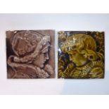 A pair of 19th century tiles with relief moulded decoration, profile portraits of children, one in a