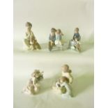 A collection of five Lladro Daisa and Nao figure groups of children with their pets including