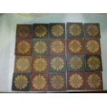 A collection of twenty 19th century encaustic type tiles of square form with stylised flower head