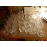 A quantity of clear cut drinking glasses to include ten tumblers with cross and other cut detail,