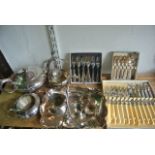 A three piece silver plated tea set comprising teapot, two handled sugar basin, milk jug, all with