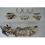A mixed quantity of silver plated and other cutlery, horseshoes, etc