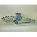 A collection of 19th century and other blue and white ceramics including a basket in the 18th