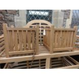 A pair of good quality contemporary teak planters of square cut form with vertical slatted panels