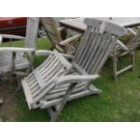 A good quality weathered contemporary teak steamer type chair with slatted folding frame, foot